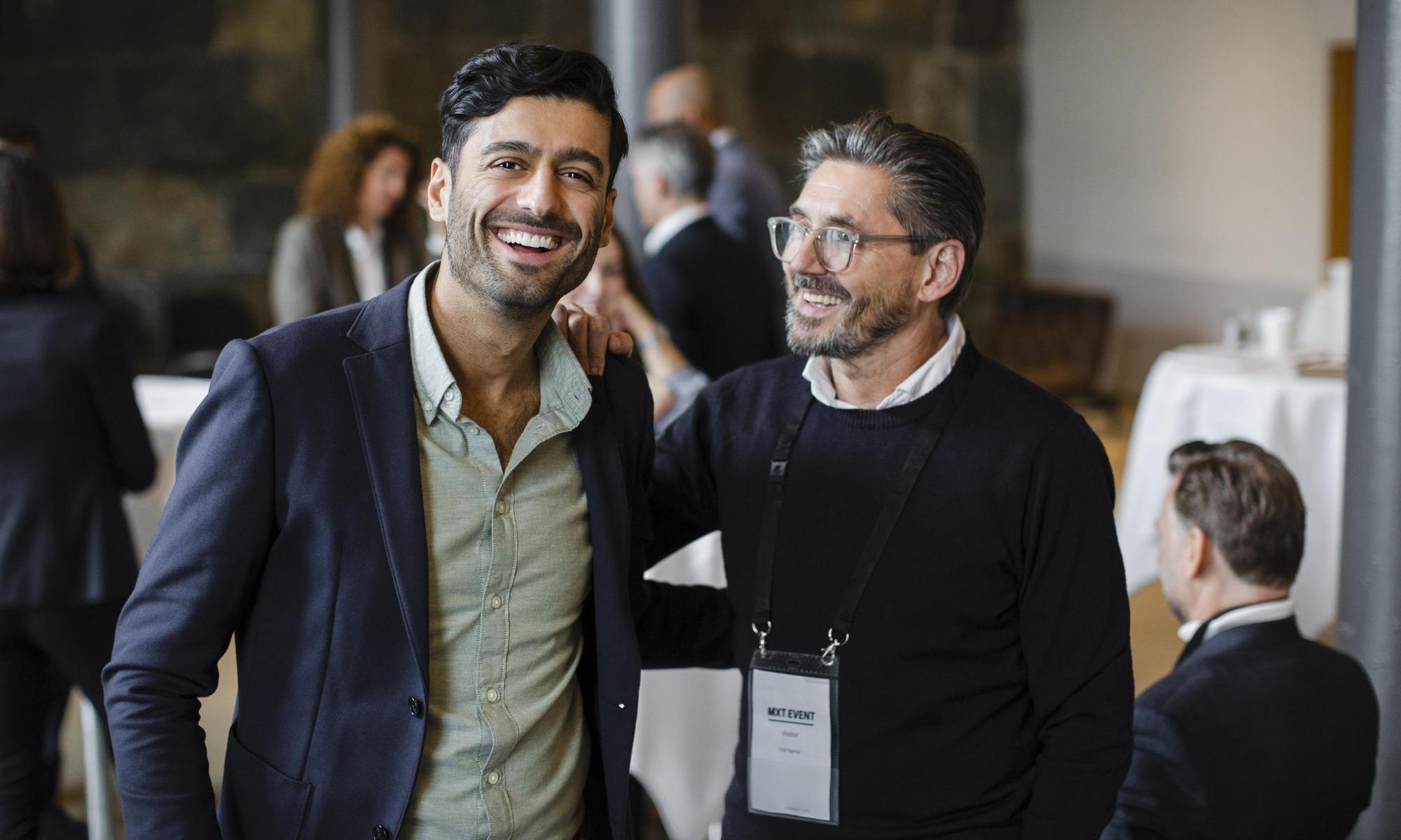 Two men at a business conference