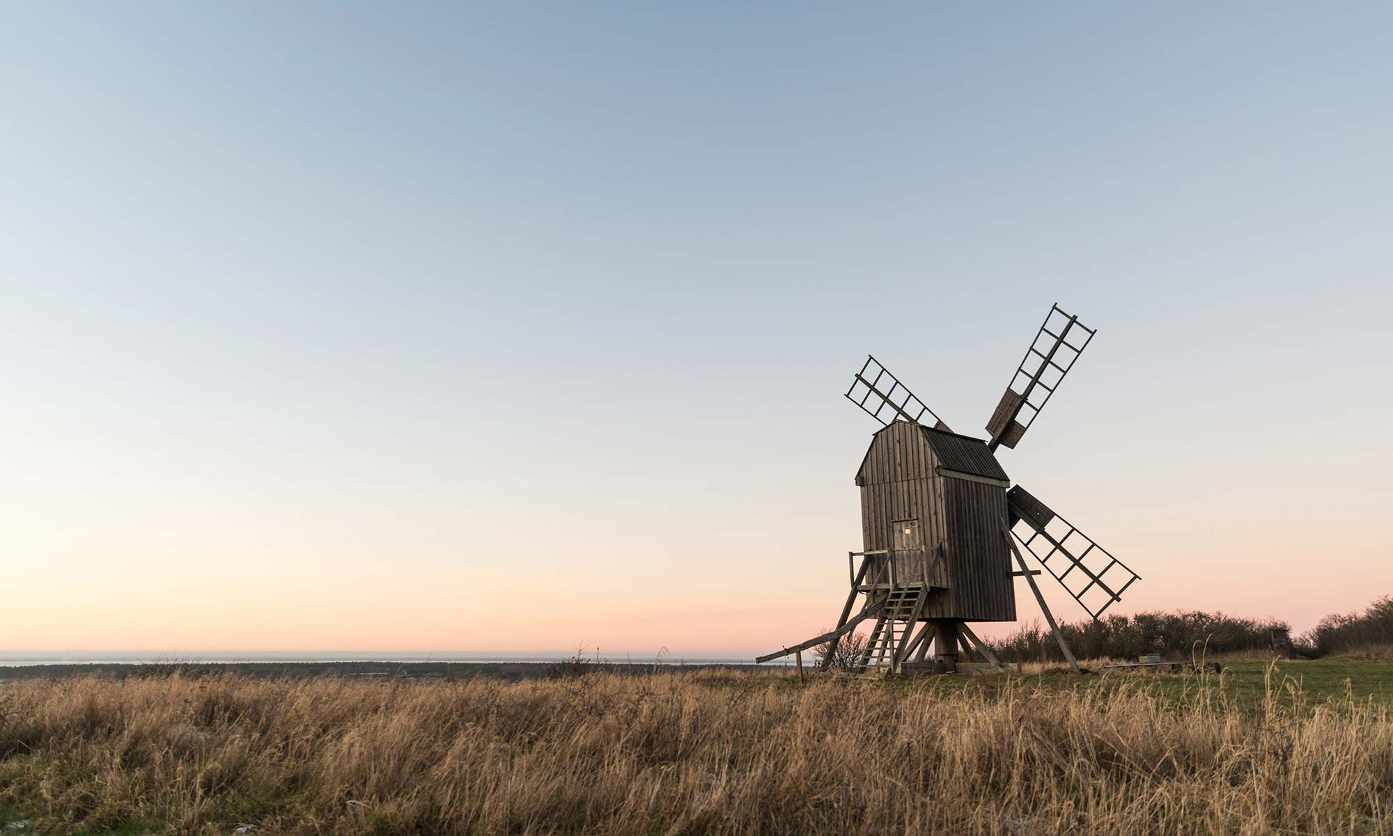 Old wooden windmill in dawn.